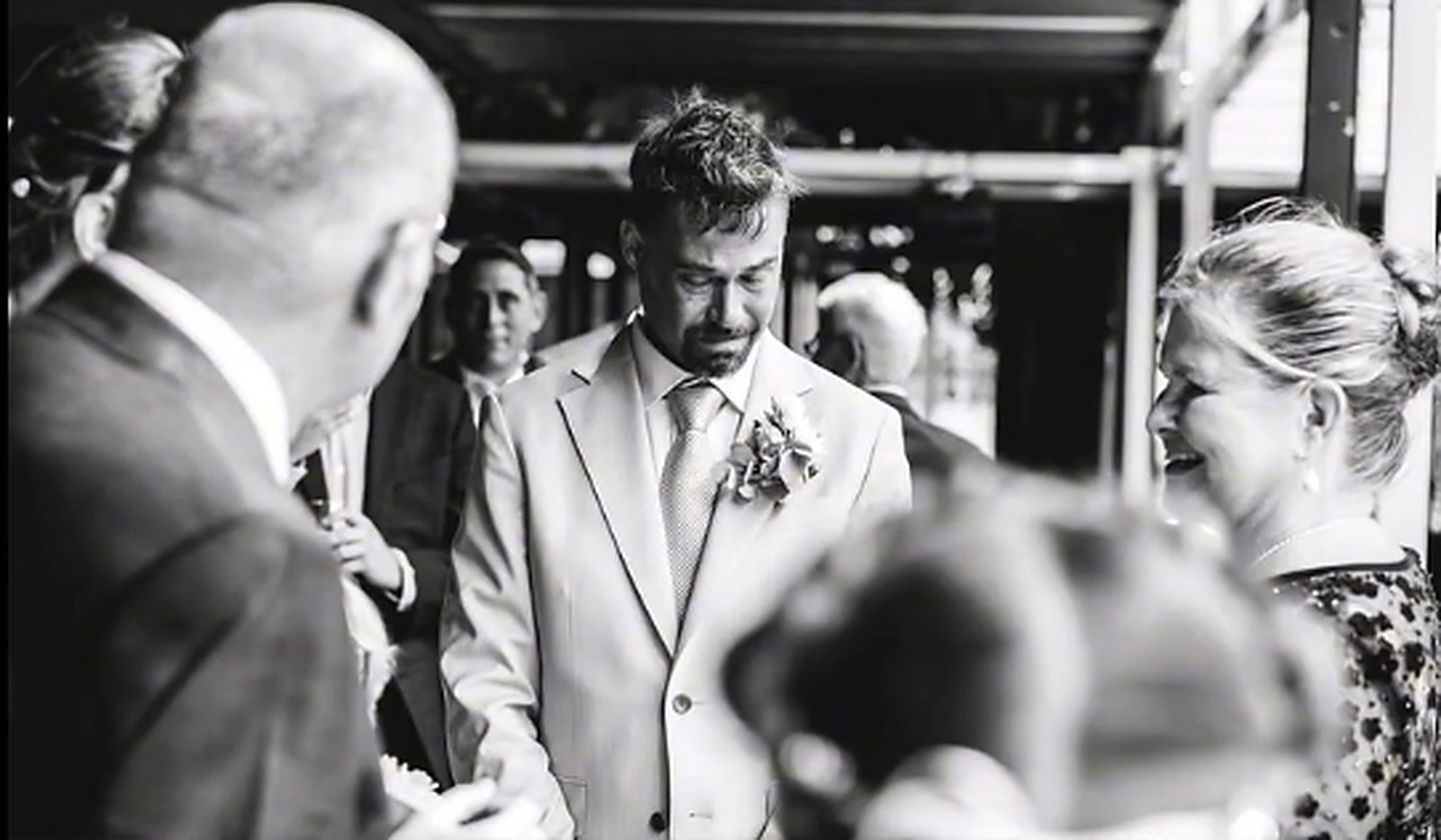 The groom waiting among the guests, visibly moved