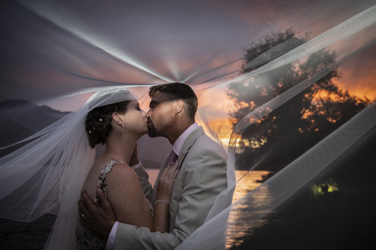 Wedding at Piccolo Lago, Mergozzo, the sunset kiss beneath the veil